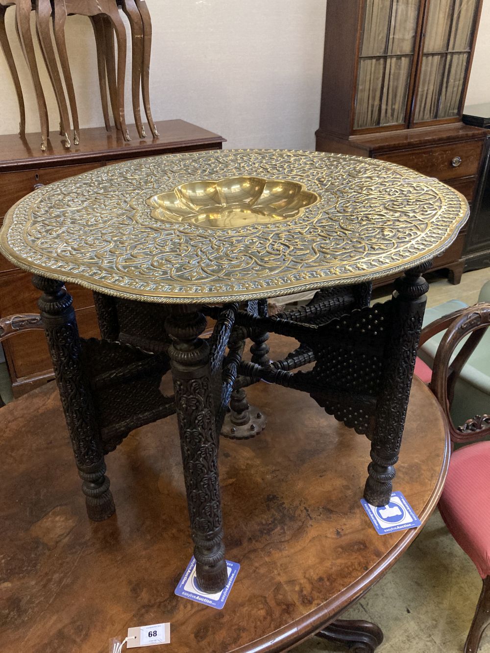 A Benares brass tray top table, 78cm diameter, 62cm high